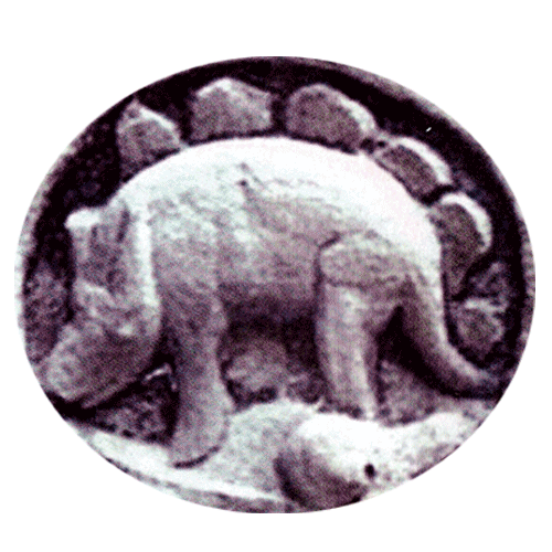 What looks like a stegosaurus, shot taken at a temple in Cambodia, scanned in from a magazine